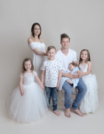 family of 6 having a family photo shoot with princess dresses