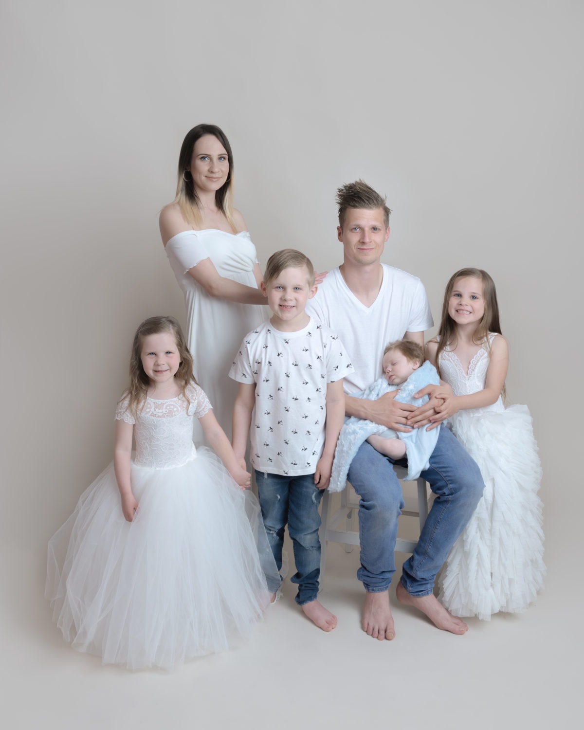 family of 6 having a family photo shoot with princess dresses